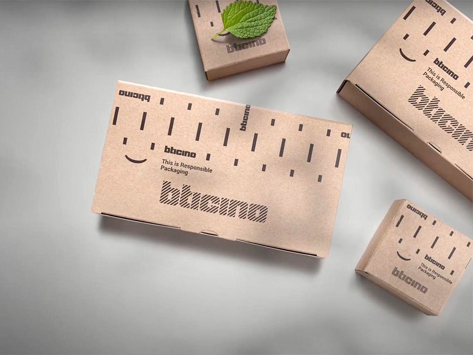 Brown cardboard boxes labeled BTicino with eco-friendly packaging symbols and a green leaf on one box.