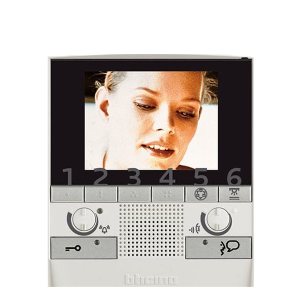 Polyx video handset Interface with a screen displaying a woman’s face and numbered buttons below the display.