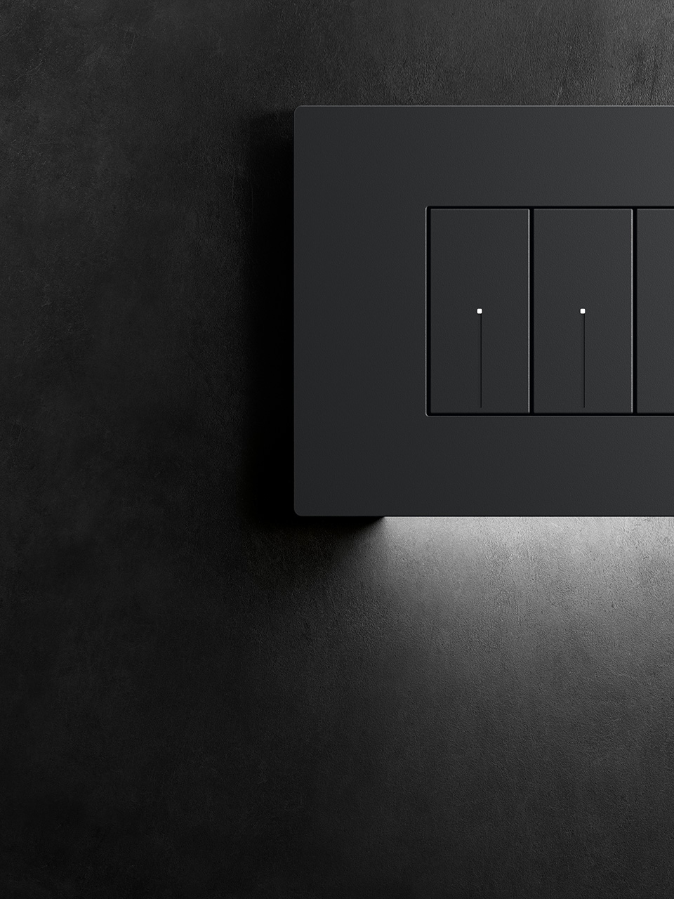The discreet built-in white LED gently illuminates the black Light Now plate, installed on a dark wall.